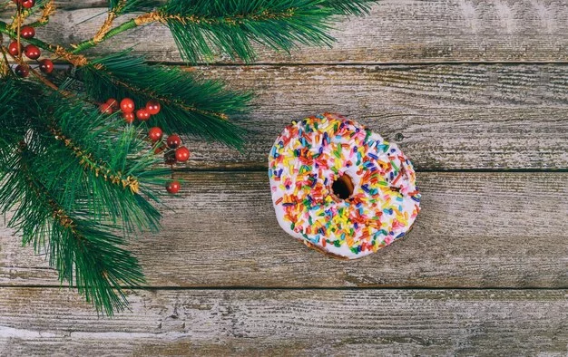 A gingerbread donut topped with glaze and festive sprinkles.
