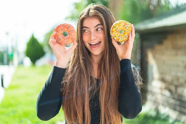 A cheerful image of a customer enjoying a free donut in front of a Lee's Donuts shop.